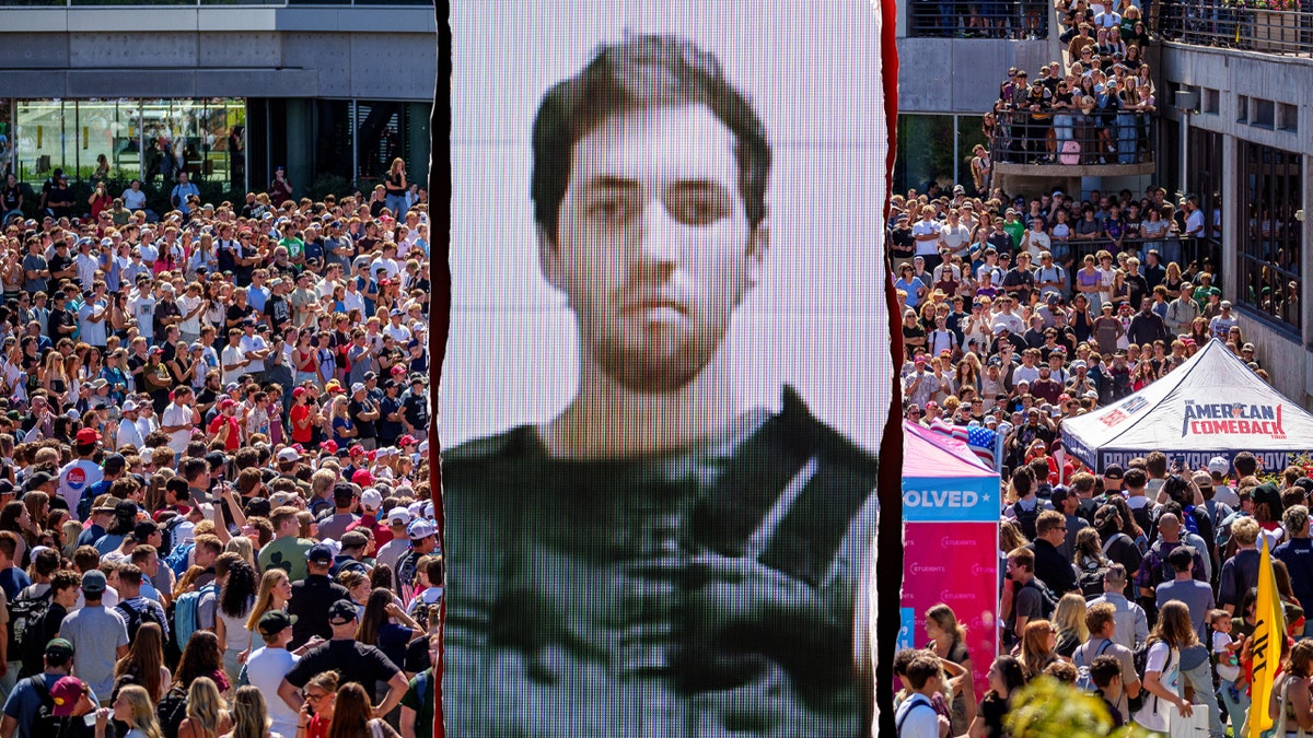 People gather to watch Charlie Kirk side by side with Tyler Robinson mug shot.