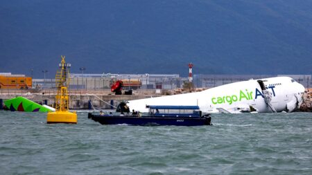 Hong Kong cargo plane skids off runway, killing two