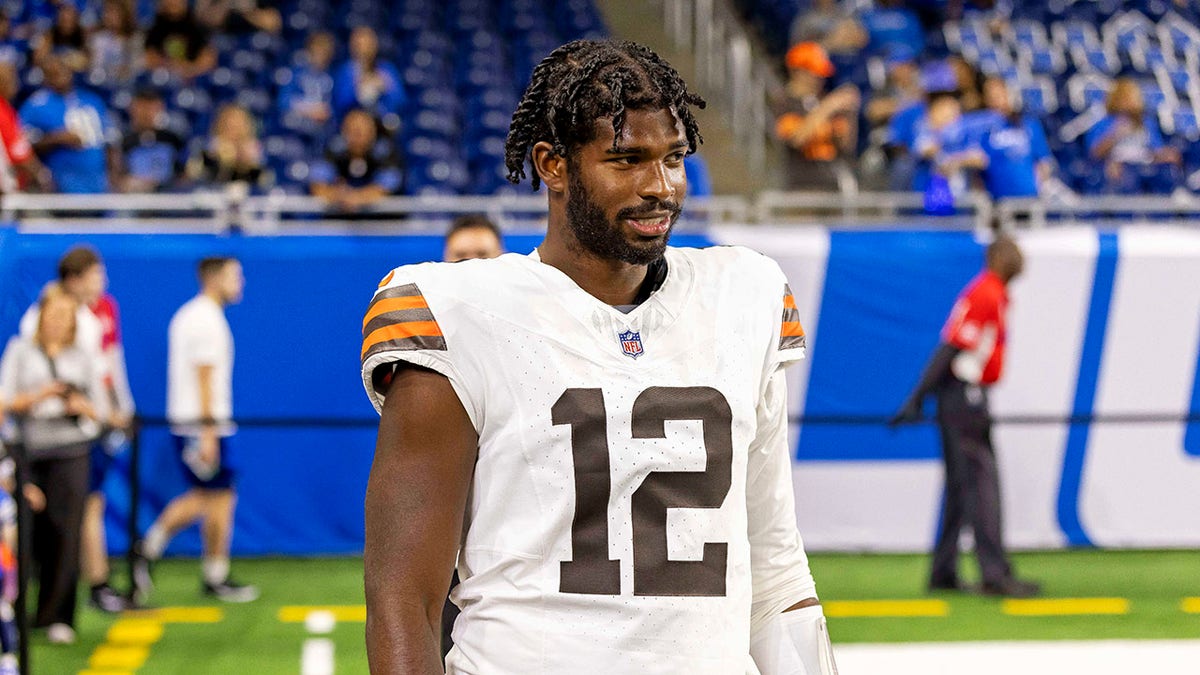 Shedeur Sanders looks on