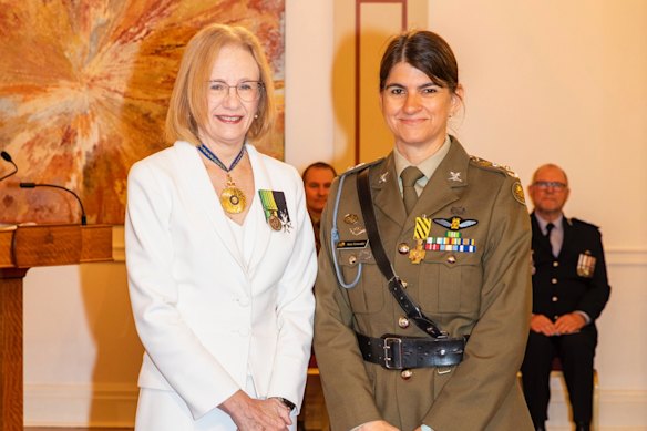 Helicopter pilot Susana Henderson with Queensland Governor Dr Jeannette Young after receiving a conspicuous service award in February for her work during the Lismore floods.
