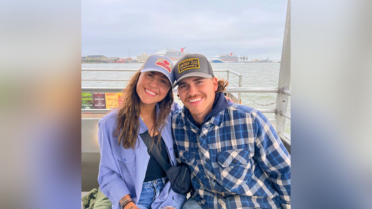 Kasydee and Hunter Bishop are seen near a shore