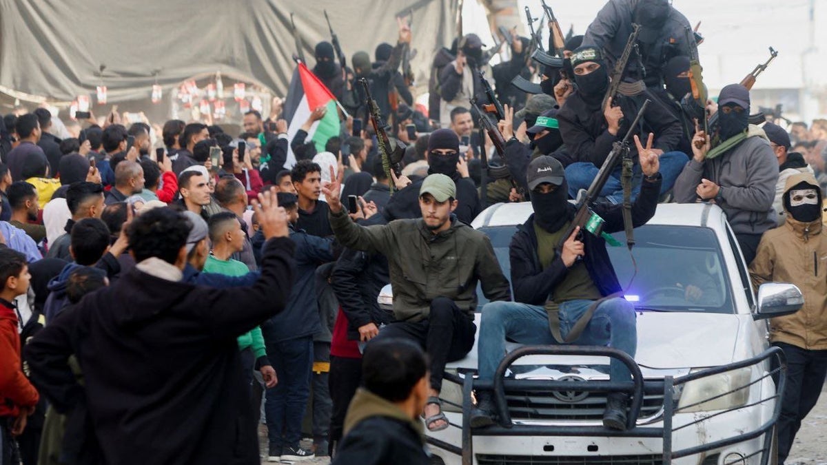 Men on cars in Gaza.