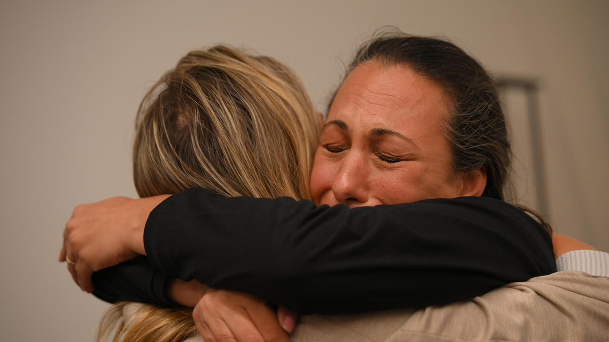 Two women hugging