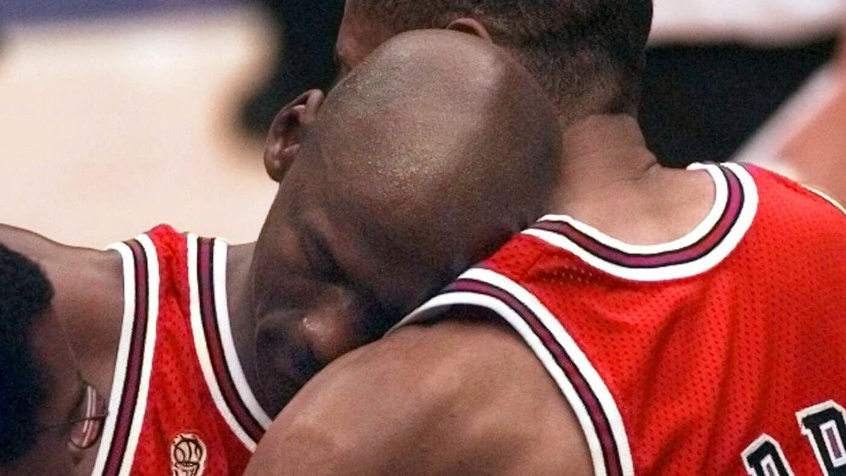 Michael Jordan being consoled by Scottie Pippen