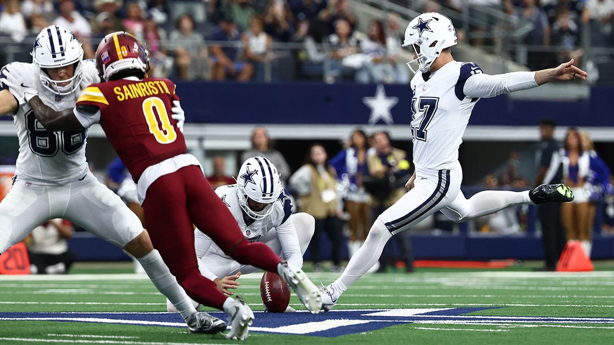 Brandon Aubrey kicks a field goal