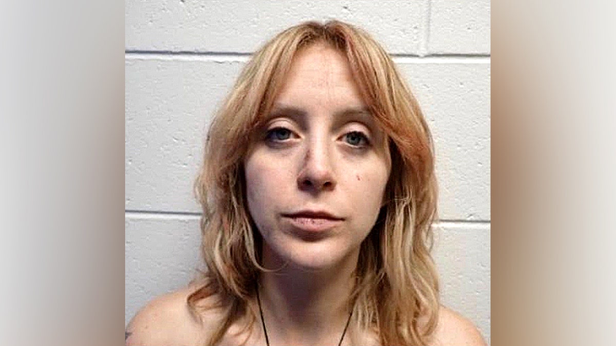 Mugshot of woman with light hair.