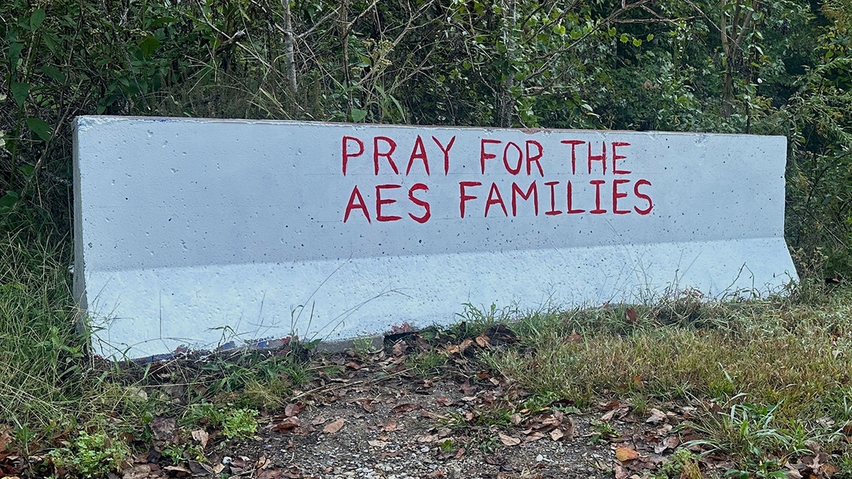 Sign that says "Pray for the AES families" following manufacturing plant explosion in Tennessee