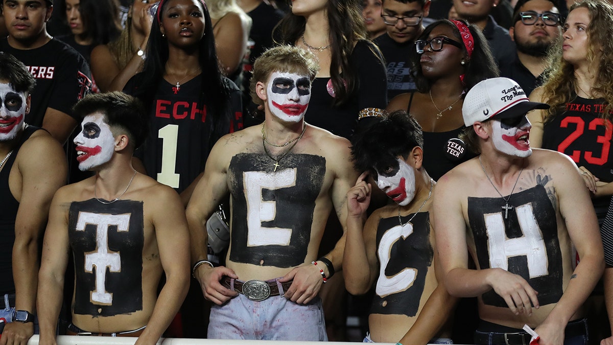 Texas Tech fans with shirts off