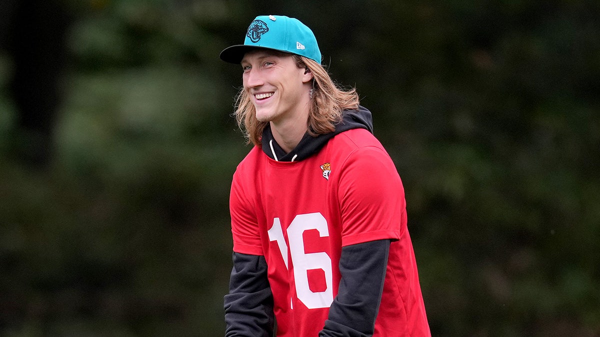 Trevor Lawrence looks on