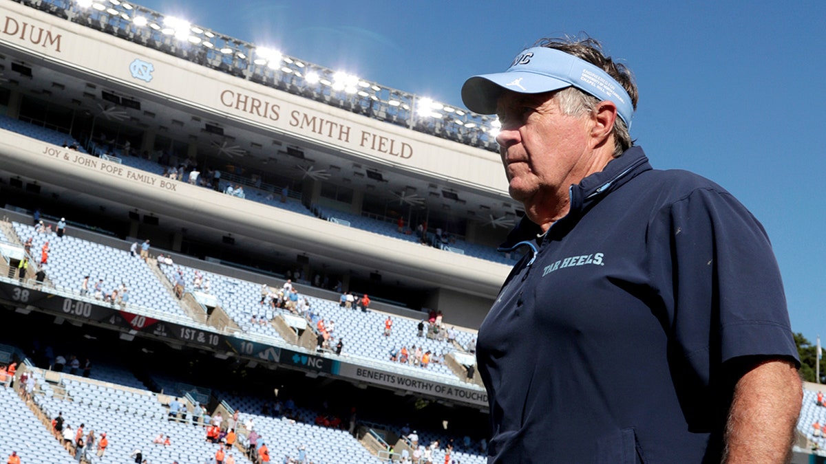 Bill Belichick walks off the field