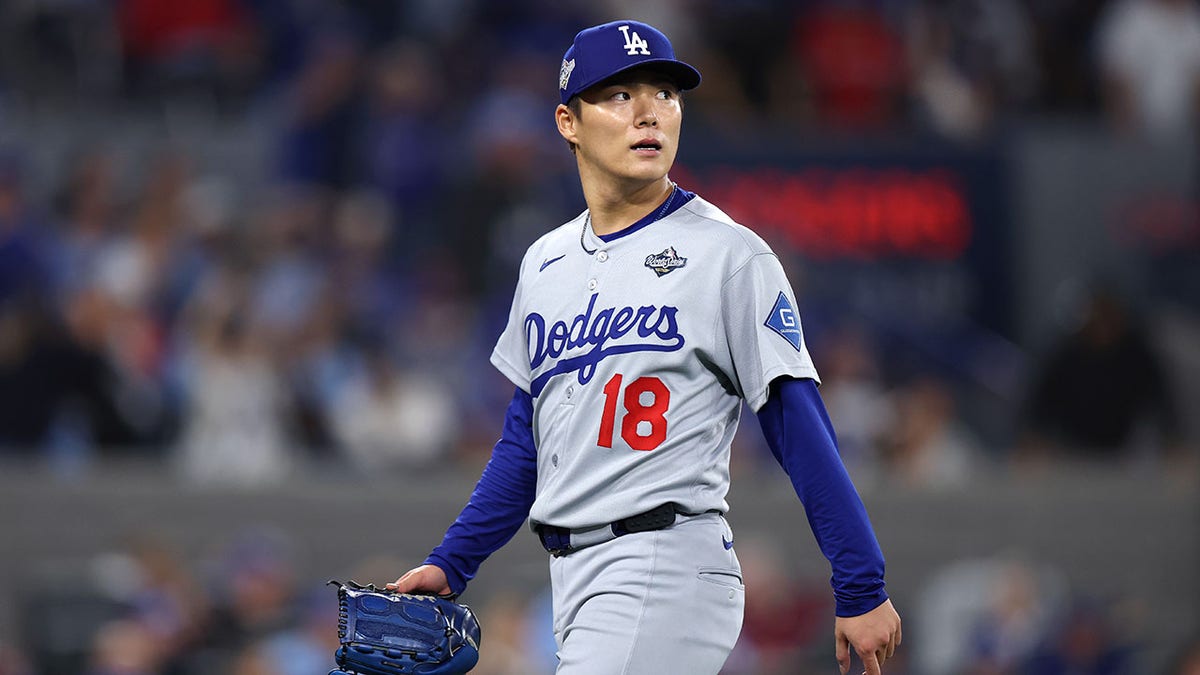 Yoshinobu Yamamoto looks on during game