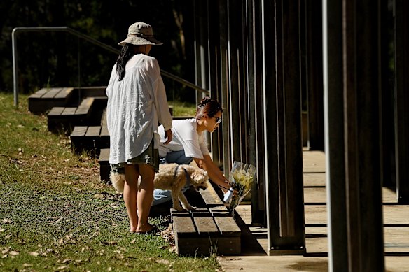 Mourners lay flowers where the teenager died.