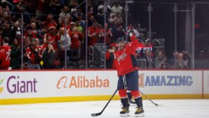 Alex Ovechkin becomes first NHL player to reach 900 goals as opposing goalie tries to hide milestone puck