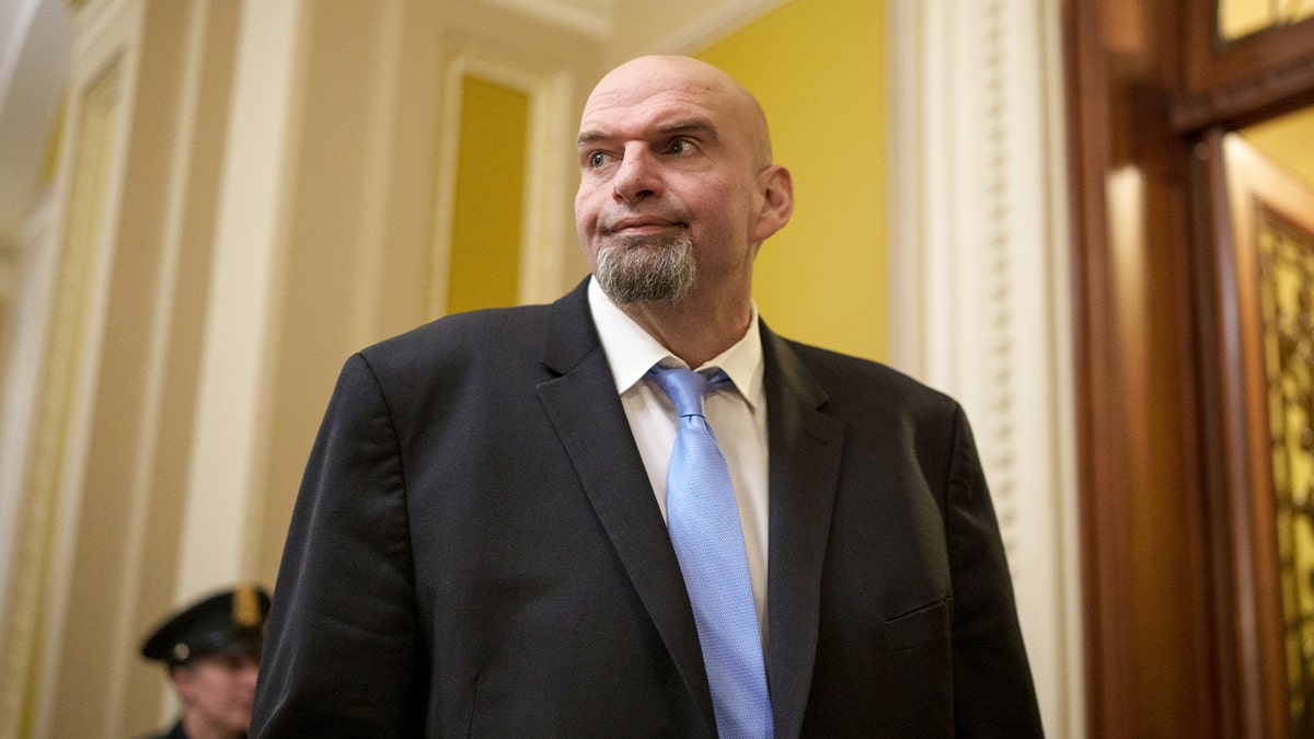 Sen. John Fetterman walks through the U.S. Capitol building on his way to a meeting.