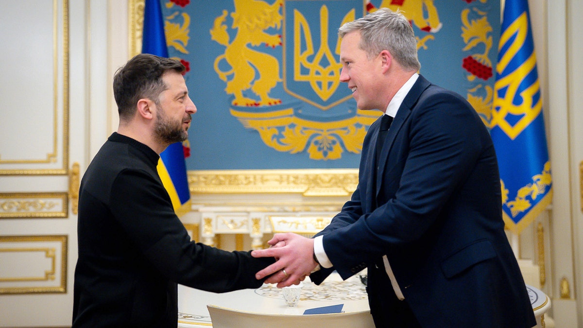 Volodymyr Zelenskyy shakes hands with U.S. Secretary of the Army Dan Driscoll during an official meeting in Kyiv.