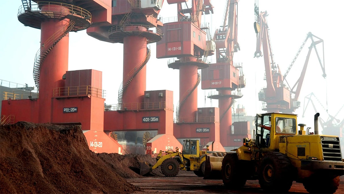 Workers transport soil containing rare earth elements for export at a port in Lianyungang, Jiangsu province, China October 31, 2010.