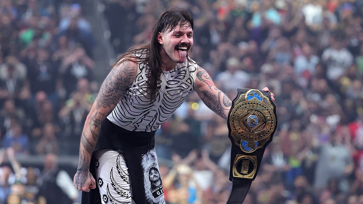 Dominik Mysterio celebrates