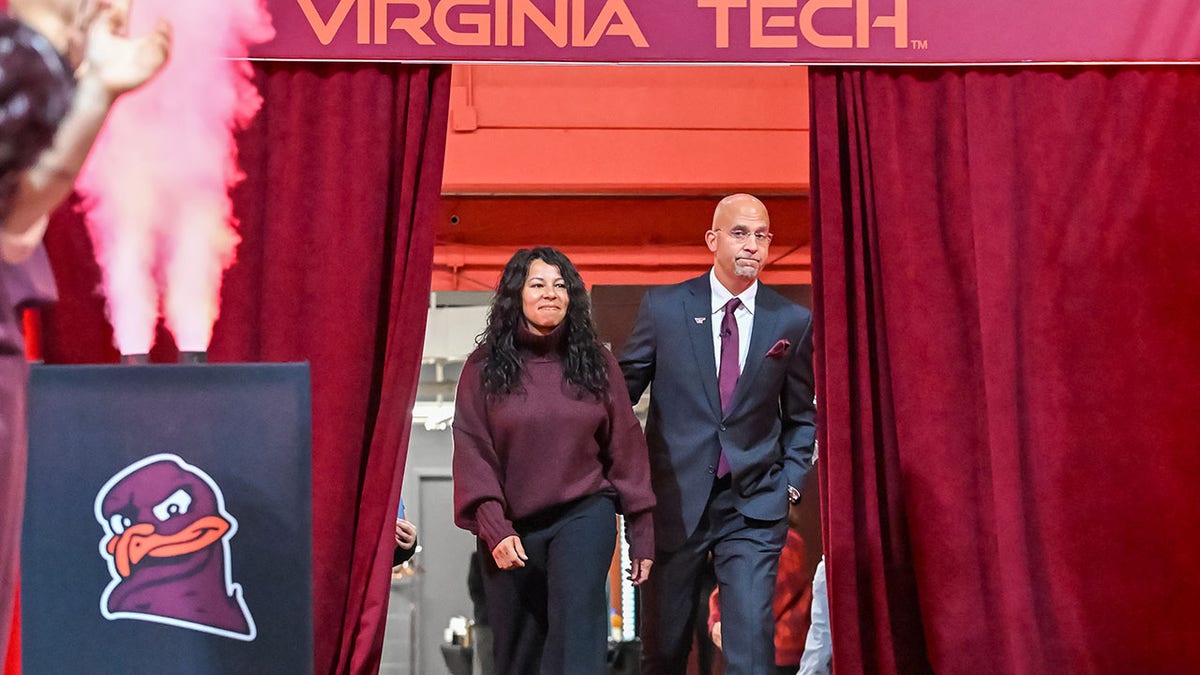 James Franklin and wife