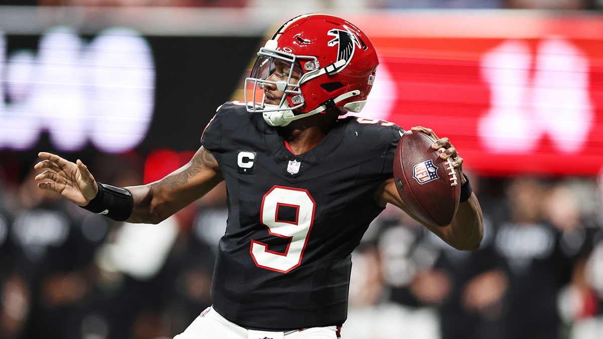 Michael Penix Jr throws the ball down field