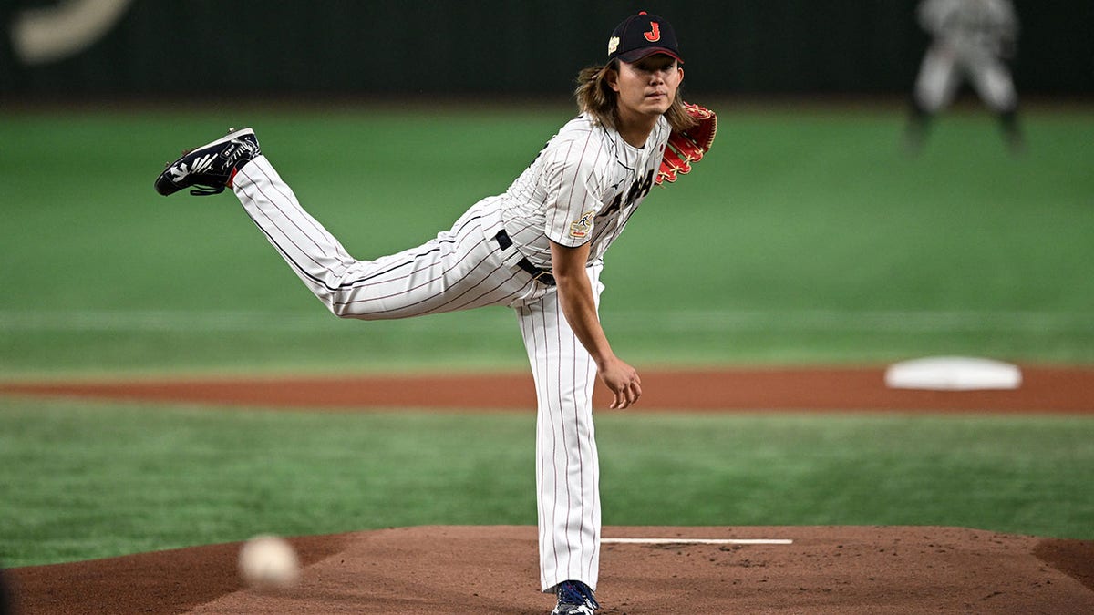 Tatsuya Imai pitches during a game