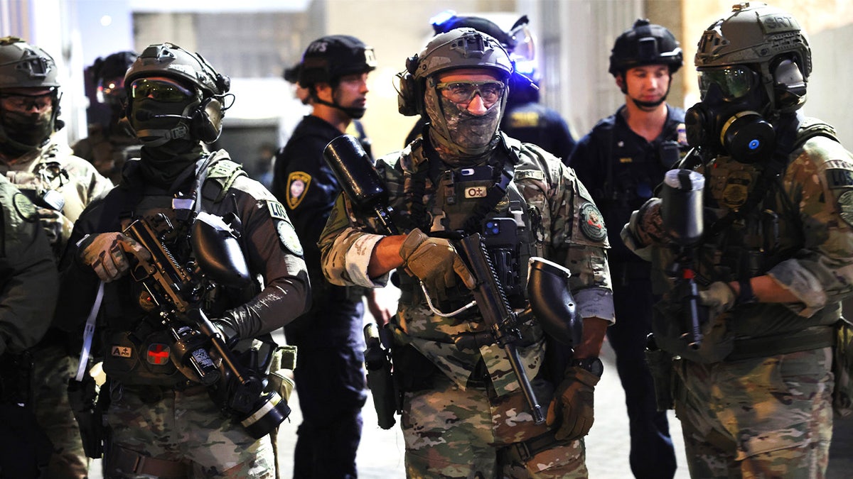 Federal troops outside an ICE facility in Portland.