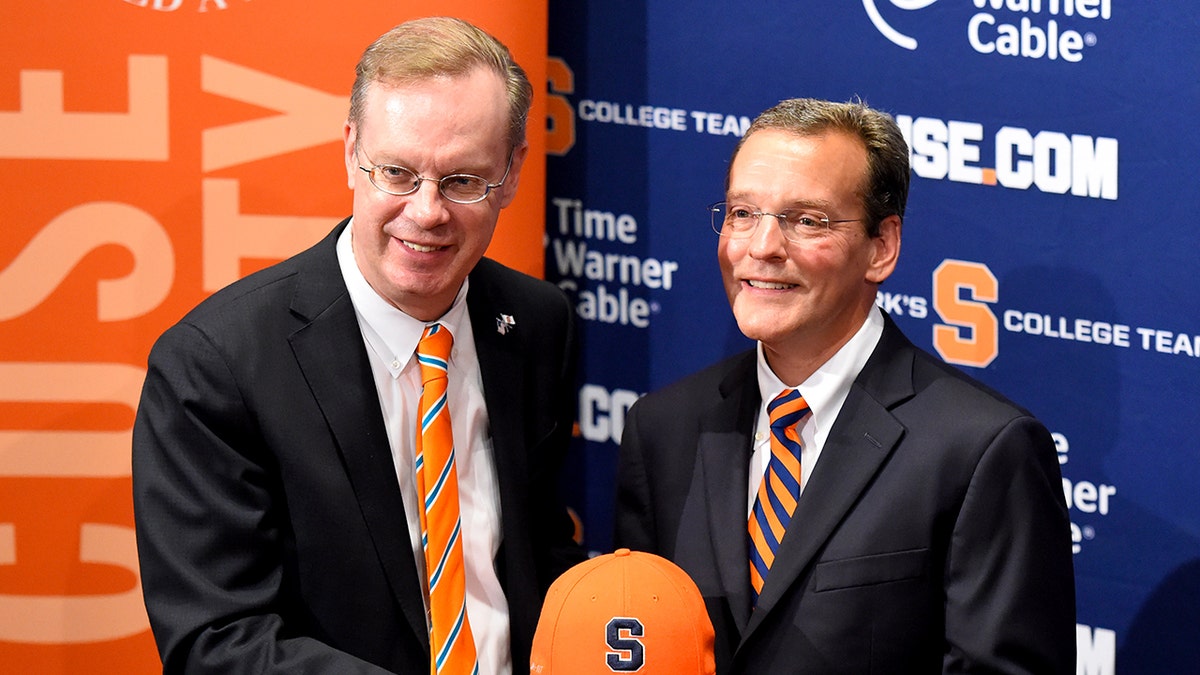 Syracuse University Chancellor Kent Syverud (left).