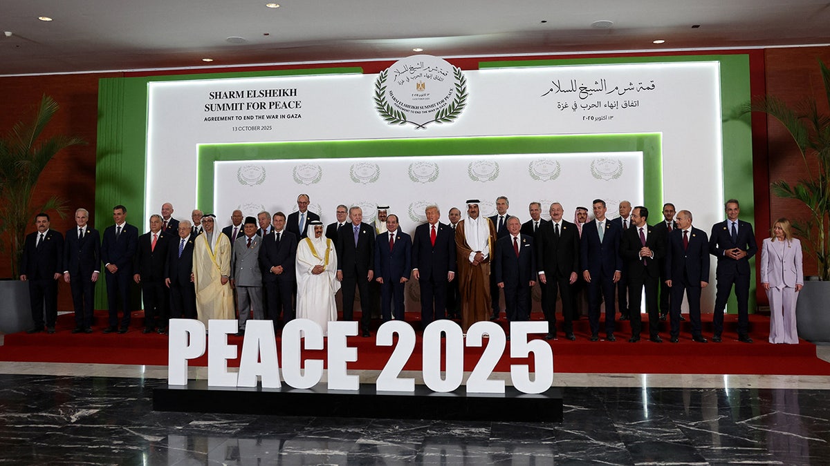 World leaders including U.S. President Donald Trump and Egypt's President Abdel Fattah al-Sisi pose for a family photo, at a world leaders' summit on ending the Gaza war