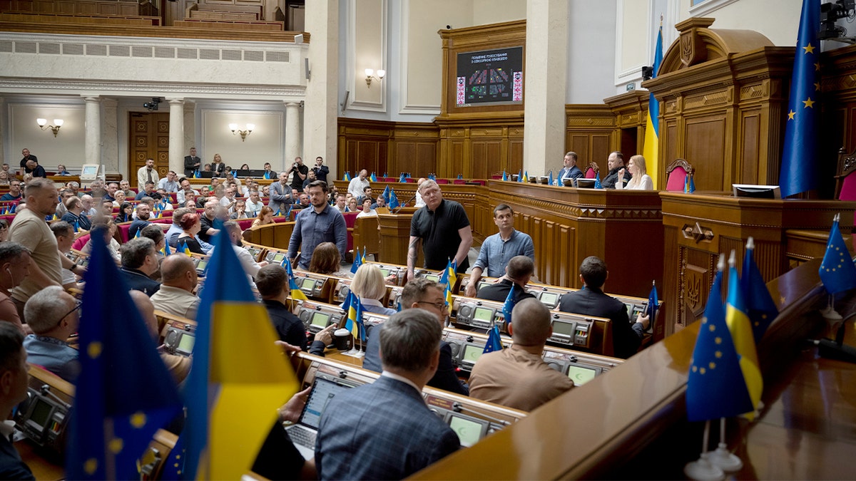 Lawmakers in Ukraine’s parliament cast their votes during a legislative session in Kyiv.