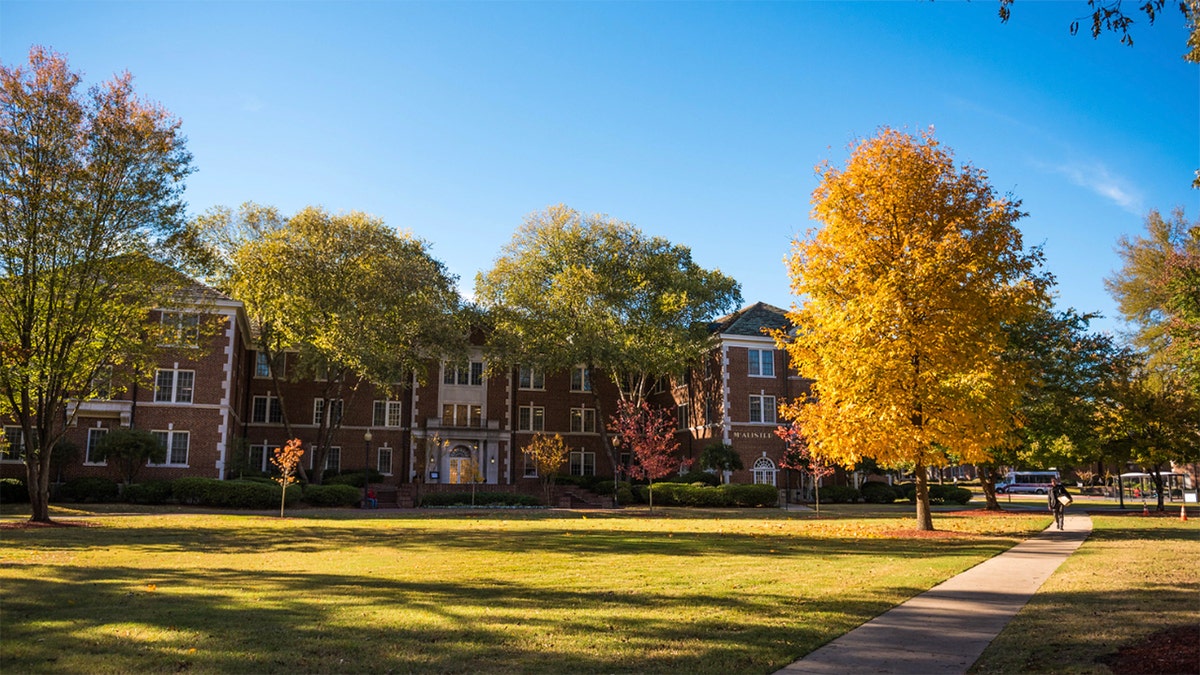 Campus buildings at the University of Central Arkansas in fall orange leaves