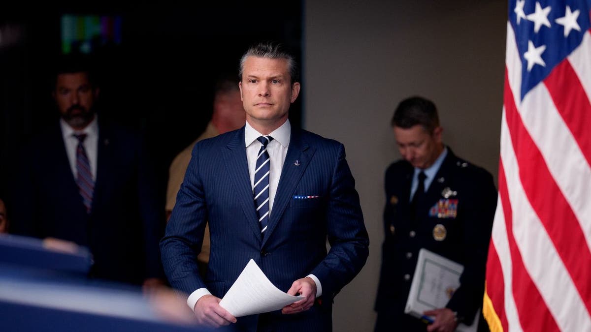 Defense Secretary Pete Hegseth arrives at a Pentagon briefing