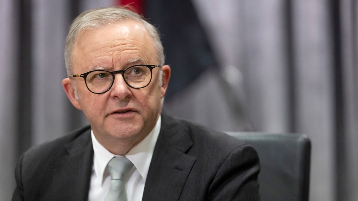 Australia’s prime minister addresses colleagues during a high-level government meeting.