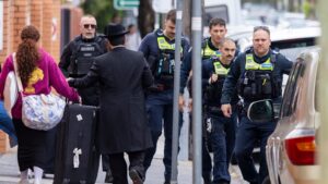 Police in Melbourne boost security as Hanukkah events cut short after Bondi shooting