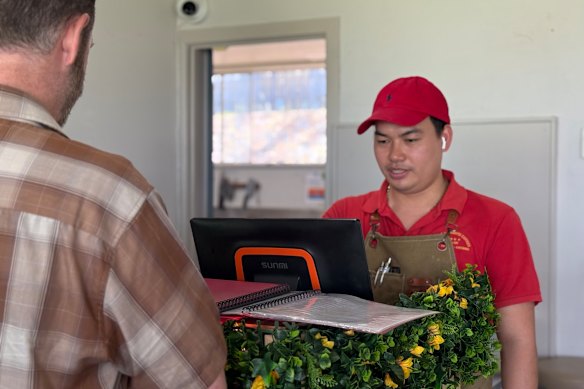 Loc Nguyen serving long-time customer Brendan Field on Monday afternoon.