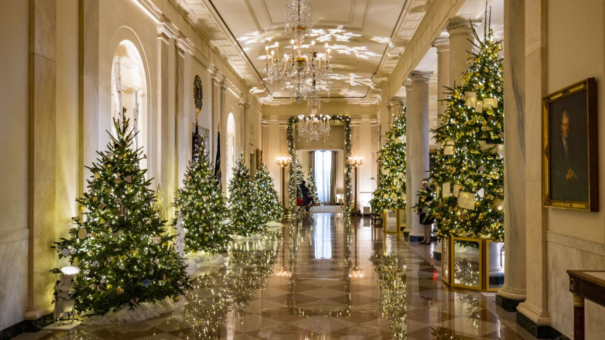 Christmas decorations are seen in the entrance and cross hall of the White House as part of first lady Jill Biden's "We the People" decorative theme in 2022.Â