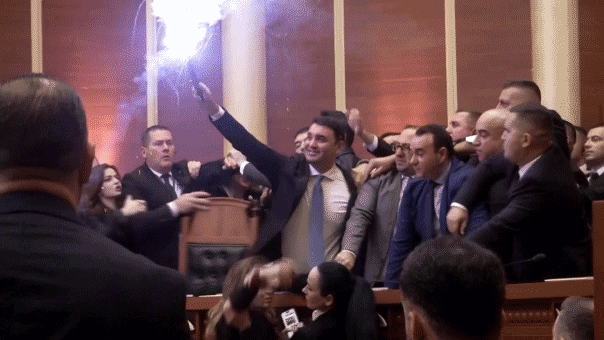Albanian opposition lawmakers light flares, scuffle with police amid parliament chaos over corruption probe
