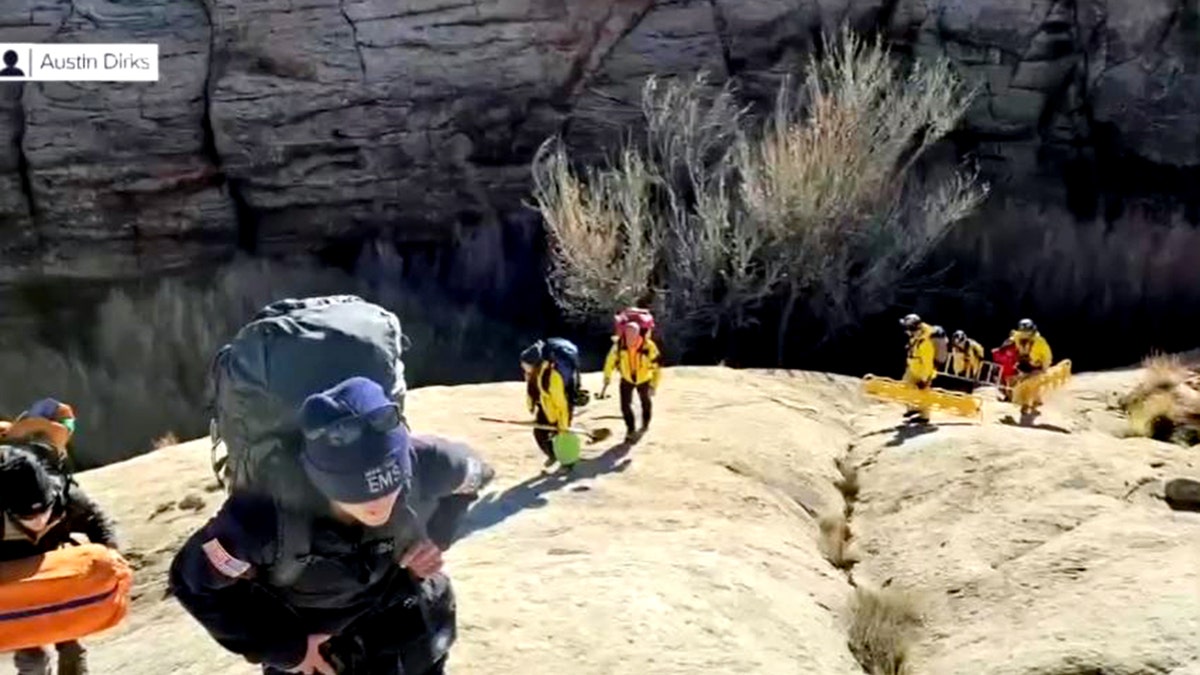 rescuers hiking up the canyon