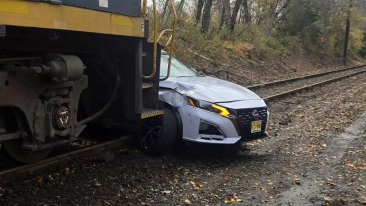 Car directly in front of train