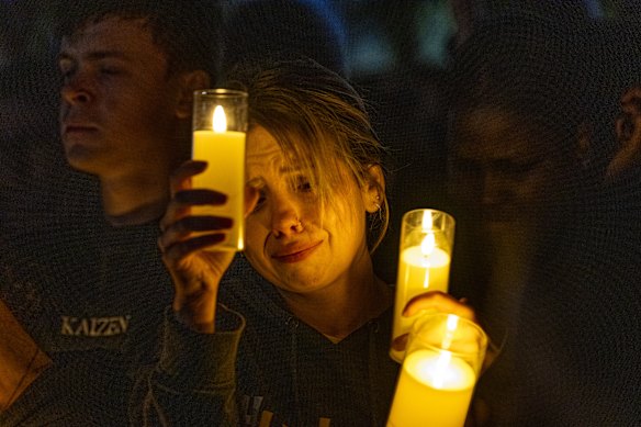 A mourner at the vigil to honour Chol Achiek, 12, and Dau Akueng, 15, who were fatally stabbed in Cobblebank.
