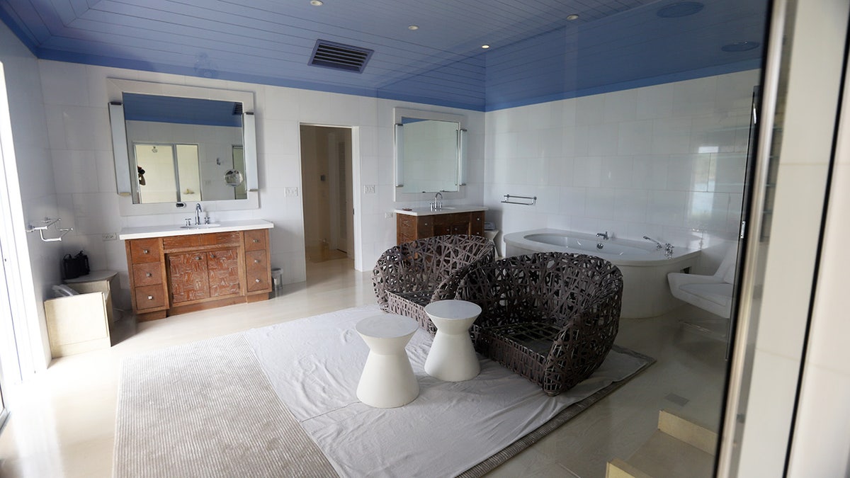 Room with chairs and tub on Epstein's island