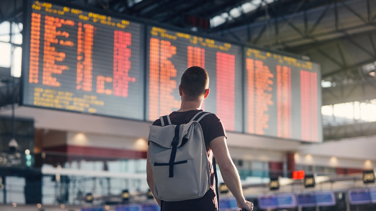 Man standing in an airport.