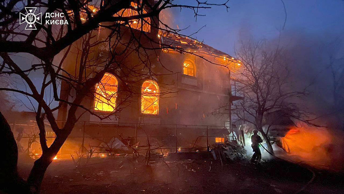 Firefighter responds to burning building in Kyiv, Ukraine