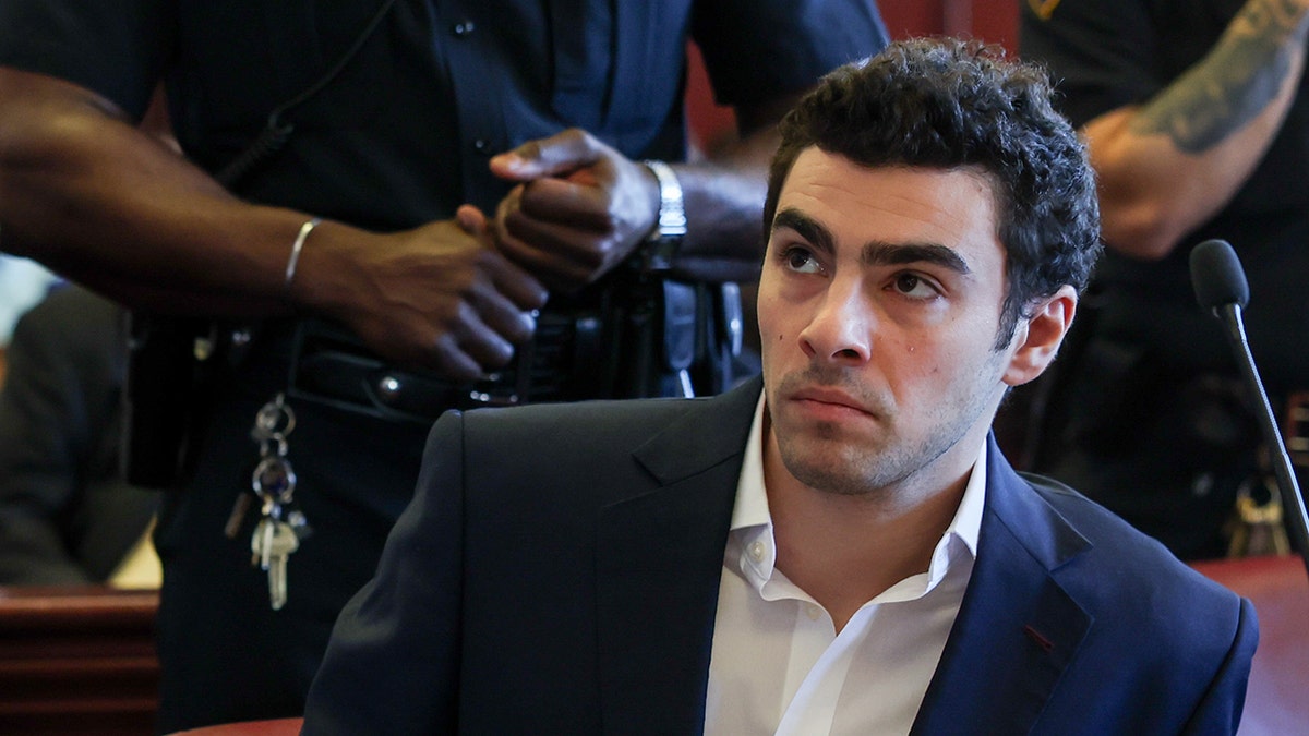 Luigi Mangione makes facial expression in court