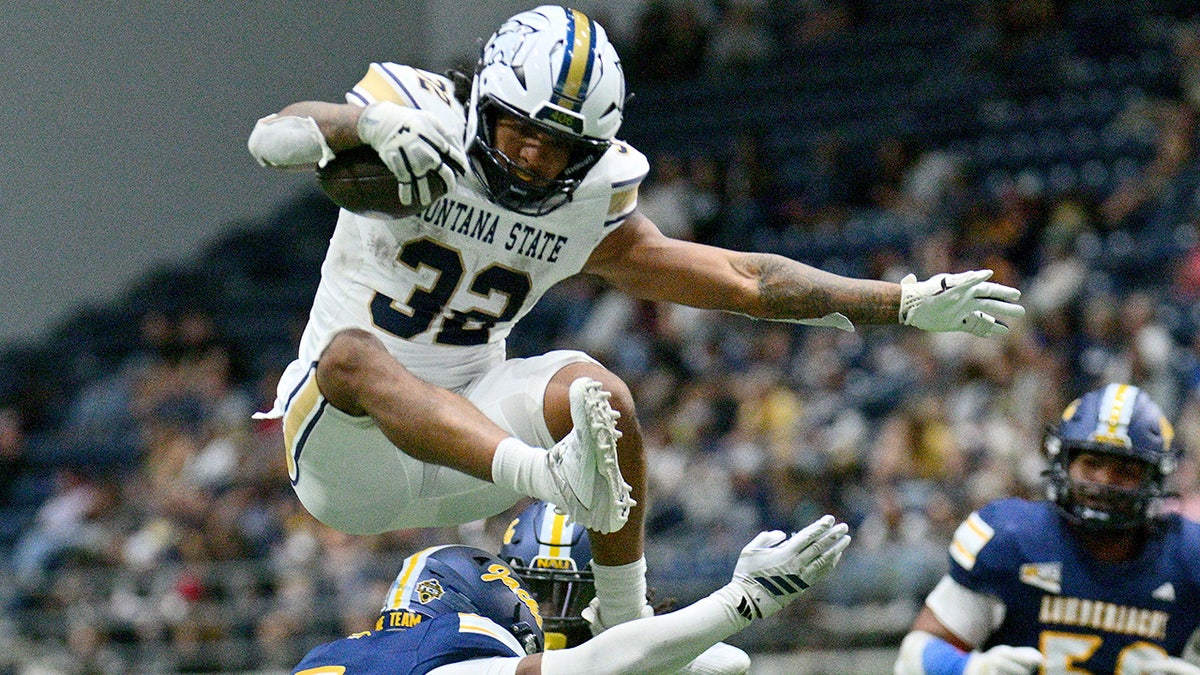 Julius Davis leaps over a defender