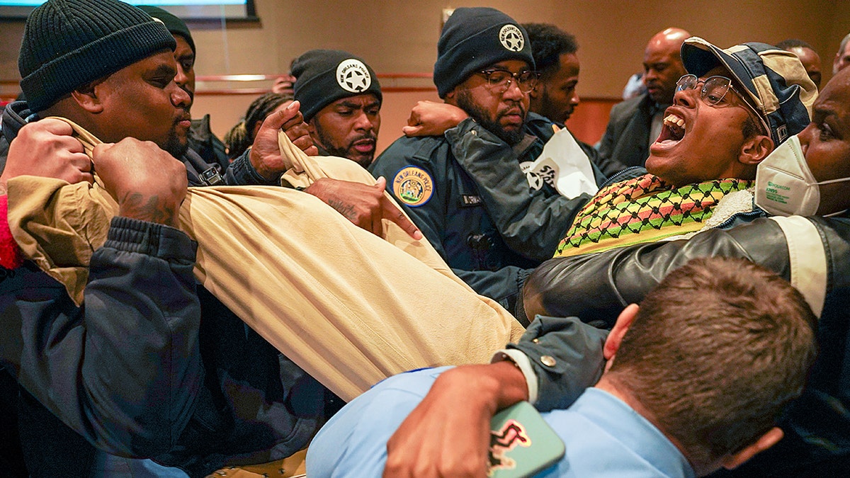 Anti-ICE agitator dragged out of New Orleans city council meeting