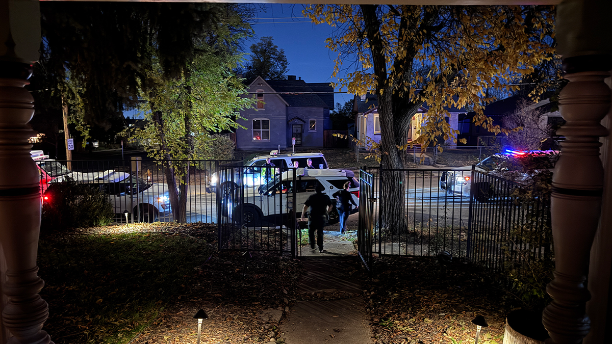 Police arrive at Root family home