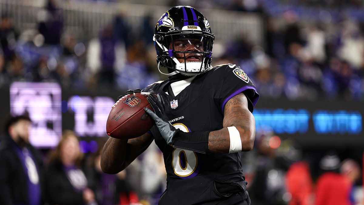 Lamar Jackson looks to pass