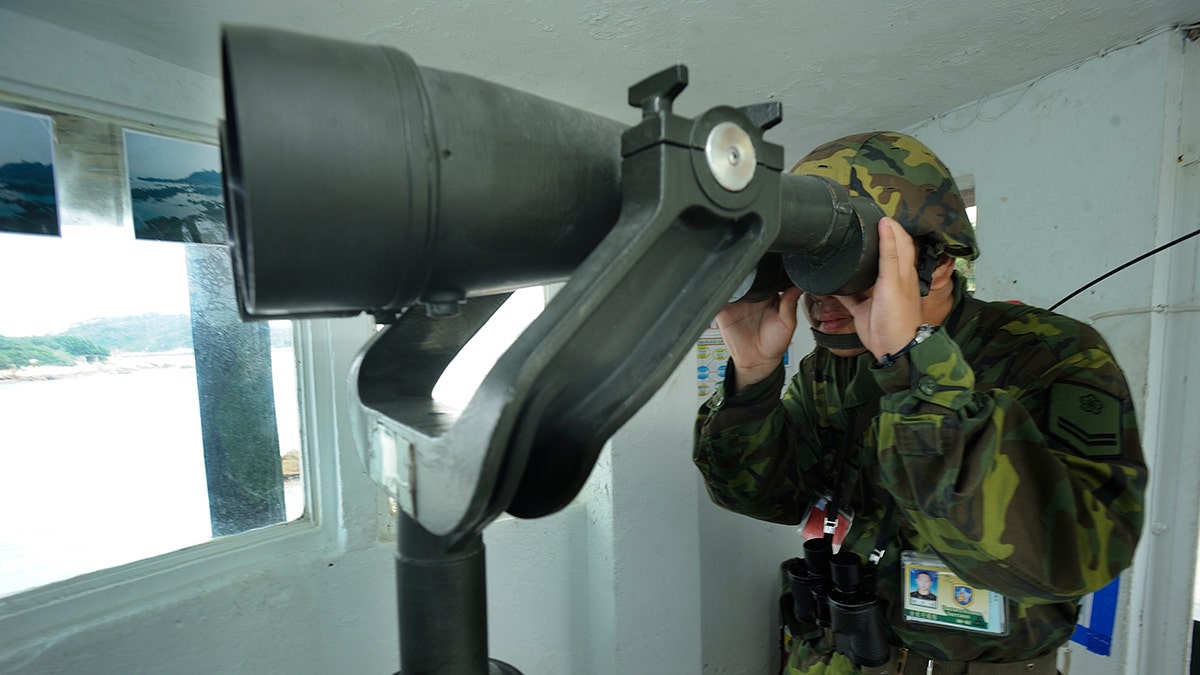 Taiwanese soldier keeping watch on the Taiwan Strait.