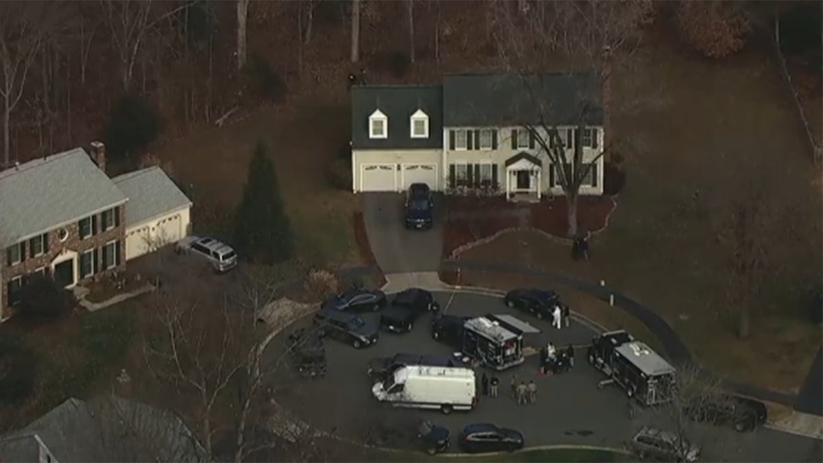 Police surrounding the pipe bomb suspect's home.