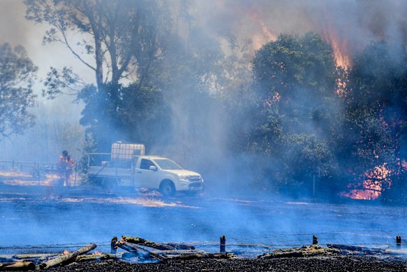 A fire crew battles a blaze in Longwood on Friday.