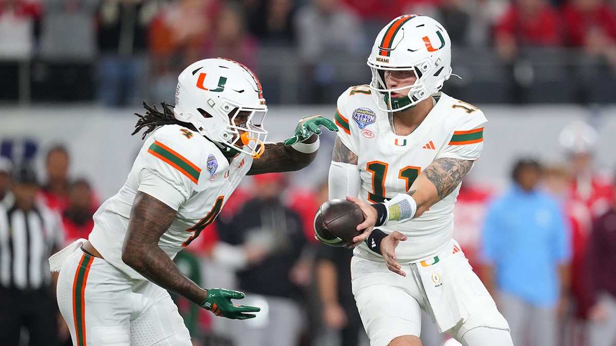 Carson Beck hands the ball to Mark Fletcher Jr.